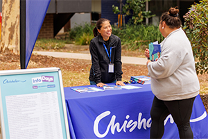 Marketing team supporting a visitor at our Info Day event