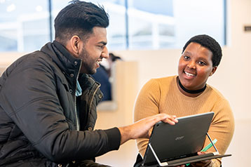 Student getting help with laptop